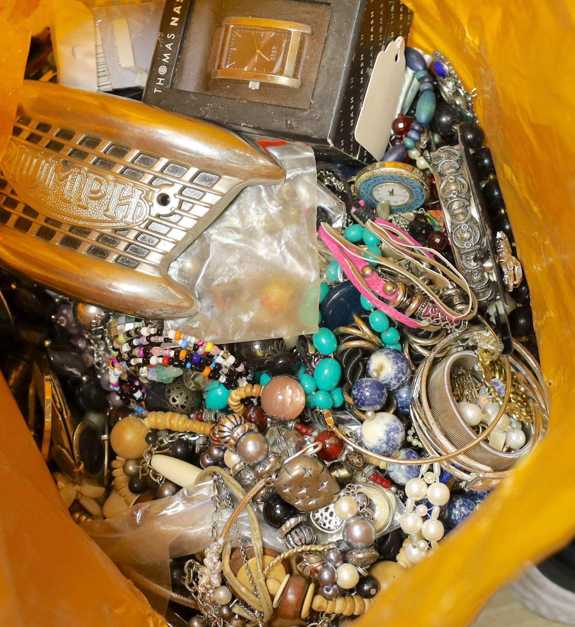 A large quantity of assorted costume jewellery, watches, clocks etc.